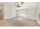 Spacious living room with carpet, overhead fan, and large window for natural light at 1145 Almondwood Dr, Trinity, FL 34655