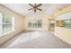 Bright living room with vaulted ceiling, carpet, and large window at 1145 Almondwood Dr, Trinity, FL 34655