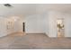 Spacious living room with neutral carpet, white walls, and ample natural light at 1145 Almondwood Dr, Trinity, FL 34655