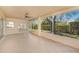 Screened-in lanai providing a relaxing view of the serene backyard at 1145 Almondwood Dr, Trinity, FL 34655