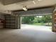 Clean and spacious two-car garage with open door at 10308 Holland Rd, Riverview, FL 33578