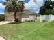 Backyard of a house with a white fence at 10308 Holland Rd, Riverview, FL 33578