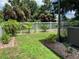 Spacious backyard with a hot tub and tropical landscaping at 10308 Holland Rd, Riverview, FL 33578