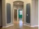 Bright hallway with arched doorways and tile flooring at 10308 Holland Rd, Riverview, FL 33578