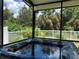 Enjoy this hot tub with a view of the backyard at 10308 Holland Rd, Riverview, FL 33578