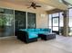 Covered patio with comfortable seating area at 10308 Holland Rd, Riverview, FL 33578