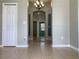 Elegant hallway with tile flooring and arched doorways at 10308 Holland Rd, Riverview, FL 33578