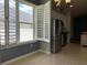 Kitchen corner with stainless steel appliances and white cabinets at 10308 Holland Rd, Riverview, FL 33578
