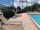 Community pool area with lounge chairs and umbrellas at 10308 Holland Rd, Riverview, FL 33578