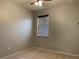 Spacious bedroom with neutral walls, carpeting, and a window with blinds at 10308 Holland Rd, Riverview, FL 33578