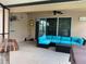 Outdoor patio area with seating and sliding glass doors at 10308 Holland Rd, Riverview, FL 33578