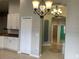 Well-lit hallway featuring arched doorways and tile floor at 10308 Holland Rd, Riverview, FL 33578