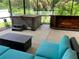Covered patio with hot tub, seating area, and wet bar at 10308 Holland Rd, Riverview, FL 33578