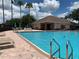 Inviting community pool with lounge chairs and a pool house at 10308 Holland Rd, Riverview, FL 33578