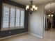 Dining room with tile floors, window with shutters, and chandelier at 10308 Holland Rd, Riverview, FL 33578