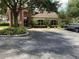 Brick community center with ample parking at 10308 Holland Rd, Riverview, FL 33578