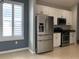 Modern kitchen features stainless steel appliances and granite counters at 10308 Holland Rd, Riverview, FL 33578