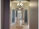 Bright and spacious entryway with tile flooring and a beautiful chandelier at 10308 Holland Rd, Riverview, FL 33578