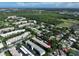 Aerial view highlighting condo building's setting amongst other buildings at 5975 Terrace Park N Dr # 211, St Petersburg, FL 33709