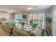 Open living space with sectional sofa, dining area and ocean view at 19836 Gulf Blvd # 5B, Indian Shores, FL 33785