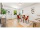 Bright dining area with glass table and orange chairs at 701 E Crenshaw St, Tampa, FL 33604