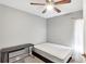 Bedroom with a full-size bed and a small workspace at 7830 Mariners Harbour Dr, Wesley Chapel, FL 33545