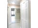 View of hallway showing closet with mirrored sliding doors and additional closet storage at 2501 Lonigan Pl, Sun City Center, FL 33573