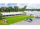 Aerial view of community building with ample parking and well-manicured lawn at 5733 Pawnee St, Zephyrhills, FL 33542
