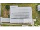 The aerial shot showcases a roof, surrounding greenery, and a neat layout, adding to the property's appeal at 5733 Pawnee St, Zephyrhills, FL 33542