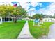 Beautifully maintained community clubhouse features lush landscaping, sidewalks and a welcoming entrance, perfect for community events at 5733 Pawnee St, Zephyrhills, FL 33542