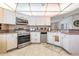 Kitchen showcases stainless steel appliances and ample countertop space at 5733 Pawnee St, Zephyrhills, FL 33542