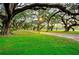A picturesque park setting with mature trees, benches, and walking paths, offering a serene escape in a natural environment at 5733 Pawnee St, Zephyrhills, FL 33542