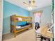 bedroom with bunk beds and built-in desk at 3145 Downan Point Dr, Land O Lakes, FL 34638