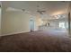 Open living room with a view into the kitchen area at 1178 Green Oak Trl, Port Charlotte, FL 33948
