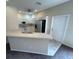 Kitchen with breakfast bar, stainless steel appliances, and tile floor at 1178 Green Oak Trl, Port Charlotte, FL 33948