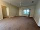 Living room with neutral walls and entryway view at 1178 Green Oak Trl, Port Charlotte, FL 33948