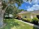 House exterior with walkway and green lawn at 1178 Green Oak Trl, Port Charlotte, FL 33948
