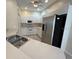 Bright kitchen with stainless steel appliances and ample cabinet space at 1178 Green Oak Trl, Port Charlotte, FL 33948