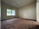 Bedroom with carpet, window, and ceiling fan at 1178 Green Oak Trl, Port Charlotte, FL 33948