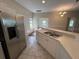 Kitchen with stainless steel refrigerator and white cabinetry at 1178 Green Oak Trl, Port Charlotte, FL 33948