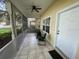 Screened porch with tile floor and seating area at 1178 Green Oak Trl, Port Charlotte, FL 33948