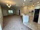 Open living room and kitchen area with neutral color palette at 1178 Green Oak Trl, Port Charlotte, FL 33948