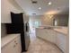 Kitchen boasting stainless steel refrigerator and white cabinets at 1178 Green Oak Trl, Port Charlotte, FL 33948