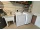 Laundry area with washer, dryer, and utility sink at 1178 Green Oak Trl, Port Charlotte, FL 33948