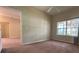 Bright bedroom with window and access to other rooms at 1178 Green Oak Trl, Port Charlotte, FL 33948