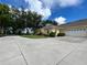 House exterior with driveway and attached garage at 1178 Green Oak Trl, Port Charlotte, FL 33948