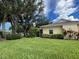 Single story house with mature trees and green lawn at 1178 Green Oak Trl, Port Charlotte, FL 33948