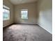 Spacious bedroom with carpet flooring and large windows at 1178 Green Oak Trl, Port Charlotte, FL 33948