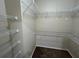 Spacious walk-in closet with wire shelving at 1178 Green Oak Trl, Port Charlotte, FL 33948