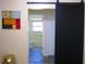 Bathroom with barn door entry, toilet, and tub at 2501 Lonigan Pl, Sun City Center, FL 33573